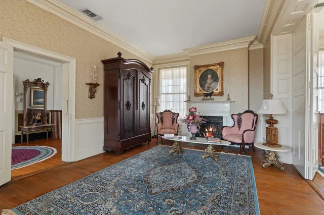 a view of a patio with a table and chairs and potted plants