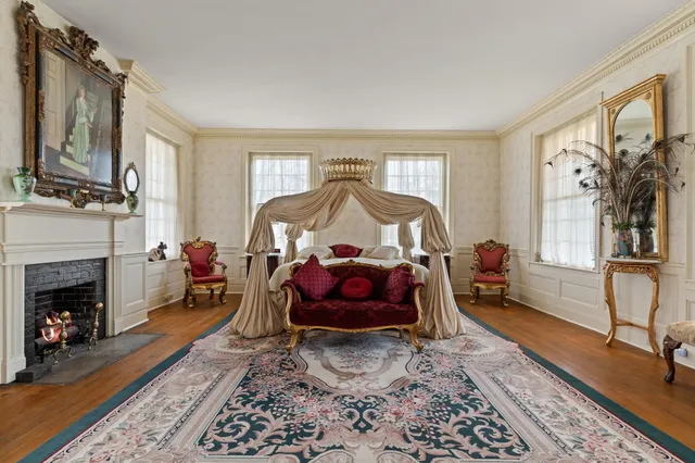 a view of a patio with a table chairs and a yard