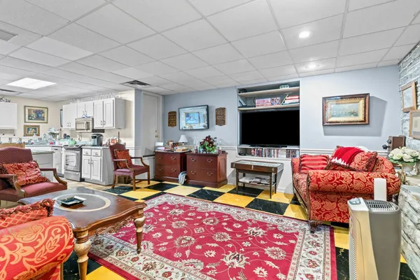 an aerial view of residential house with outdoor space and lake view