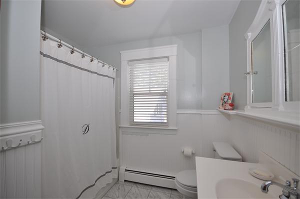 81 Rumstick Road Barrington, RI 02806 - Photo 12 of 16 a bathroom with a bathtub and a window