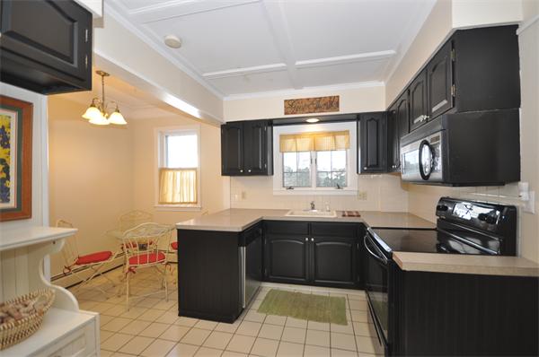 81 Rumstick Road Barrington, RI 02806 - Photo 6 of 16 a kitchen with a sink cabinets and window