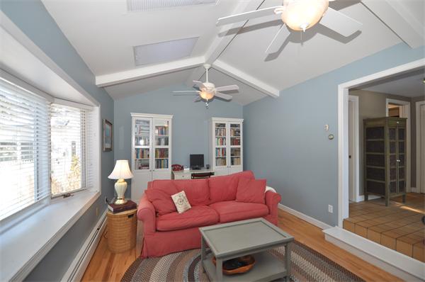 81 Rumstick Road Barrington, RI 02806 - Photo 9 of 16 a living room with furniture a chandelier and a large window