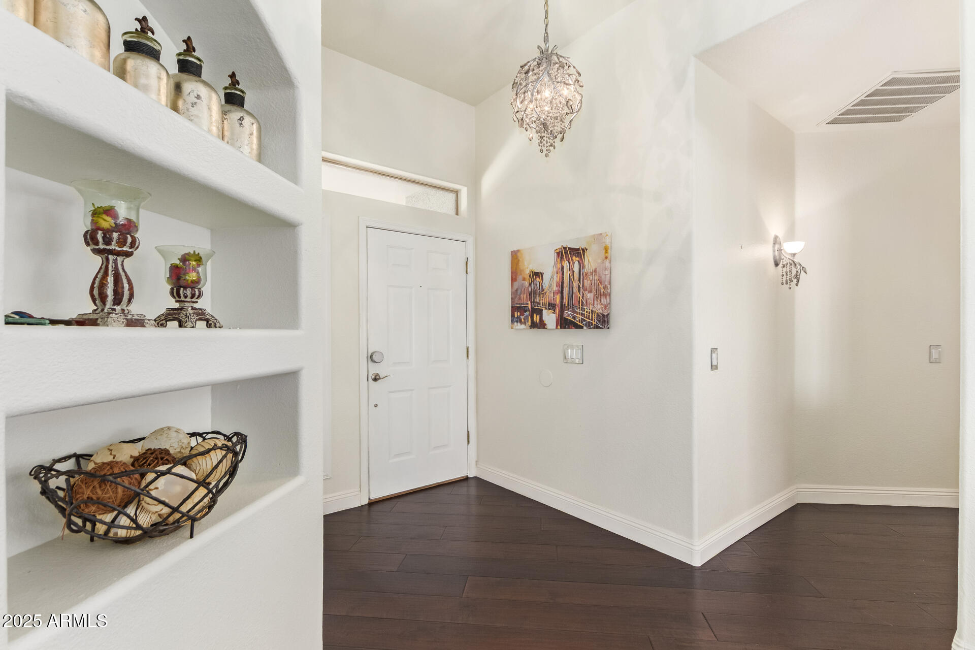 19606 North 23rd Way Phoenix, AZ 85024 - Photo 12 of 41 a view of a hallway with wooden floor and chandelier