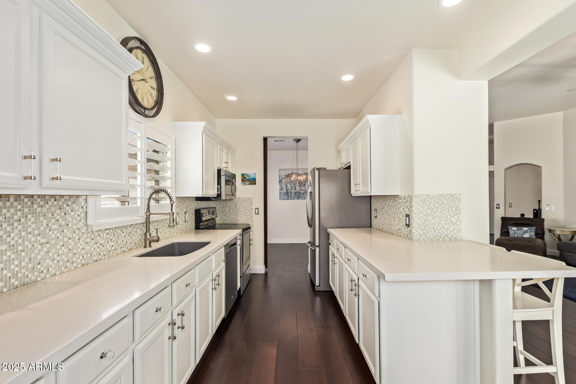 19606 North 23rd Way Phoenix, AZ 85024 - Photo 19 of 41 a kitchen with stainless steel appliances a sink and a refrigerator