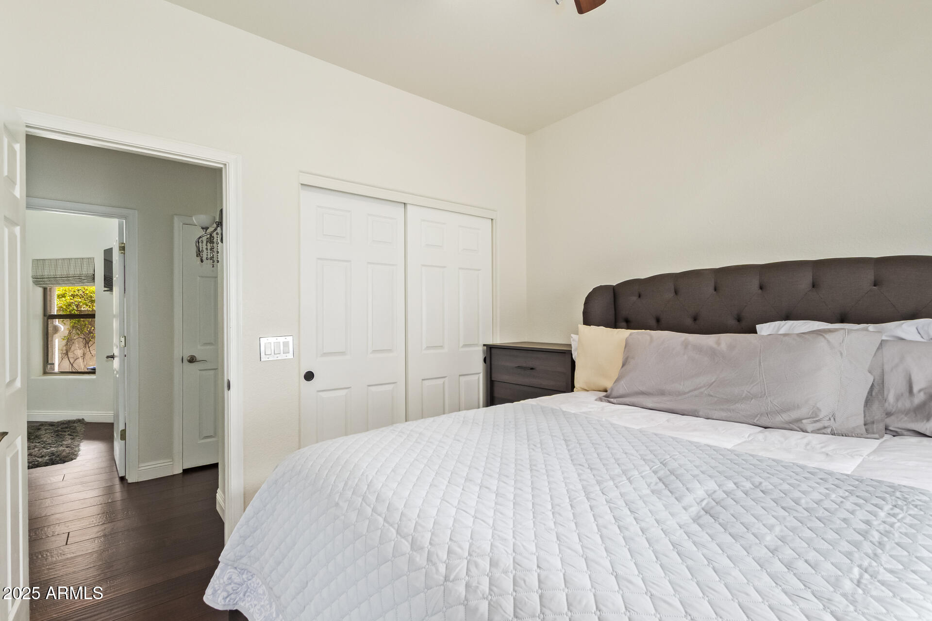 19606 North 23rd Way Phoenix, AZ 85024 - Photo 29 of 41 a bedroom with a bed and wooden floor