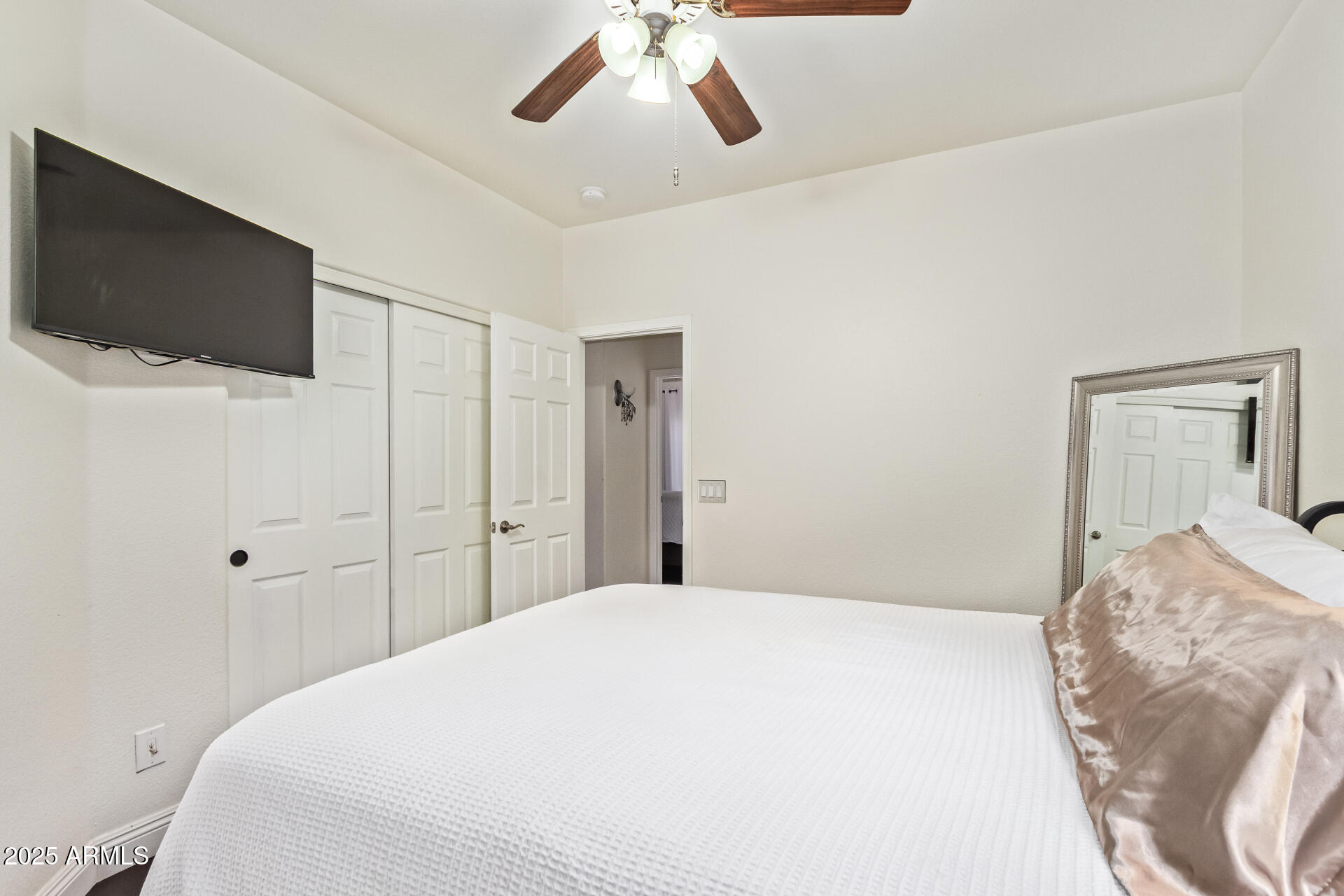 19606 North 23rd Way Phoenix, AZ 85024 - Photo 32 of 41 a bedroom with a bed and a flat screen tv