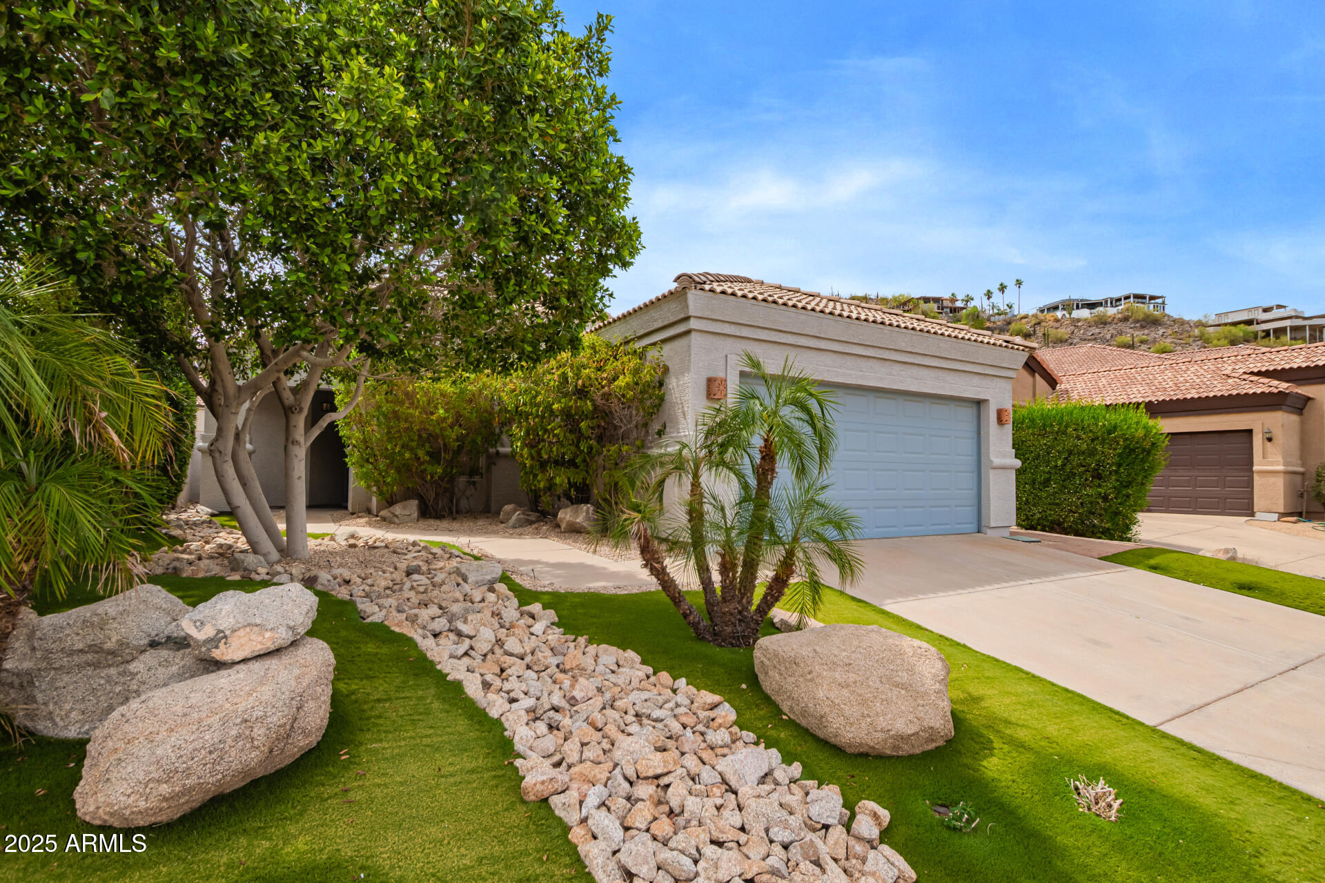 19606 North 23rd Way Phoenix, AZ 85024 - Photo 7 of 41 a view of an house with backyard space and garden