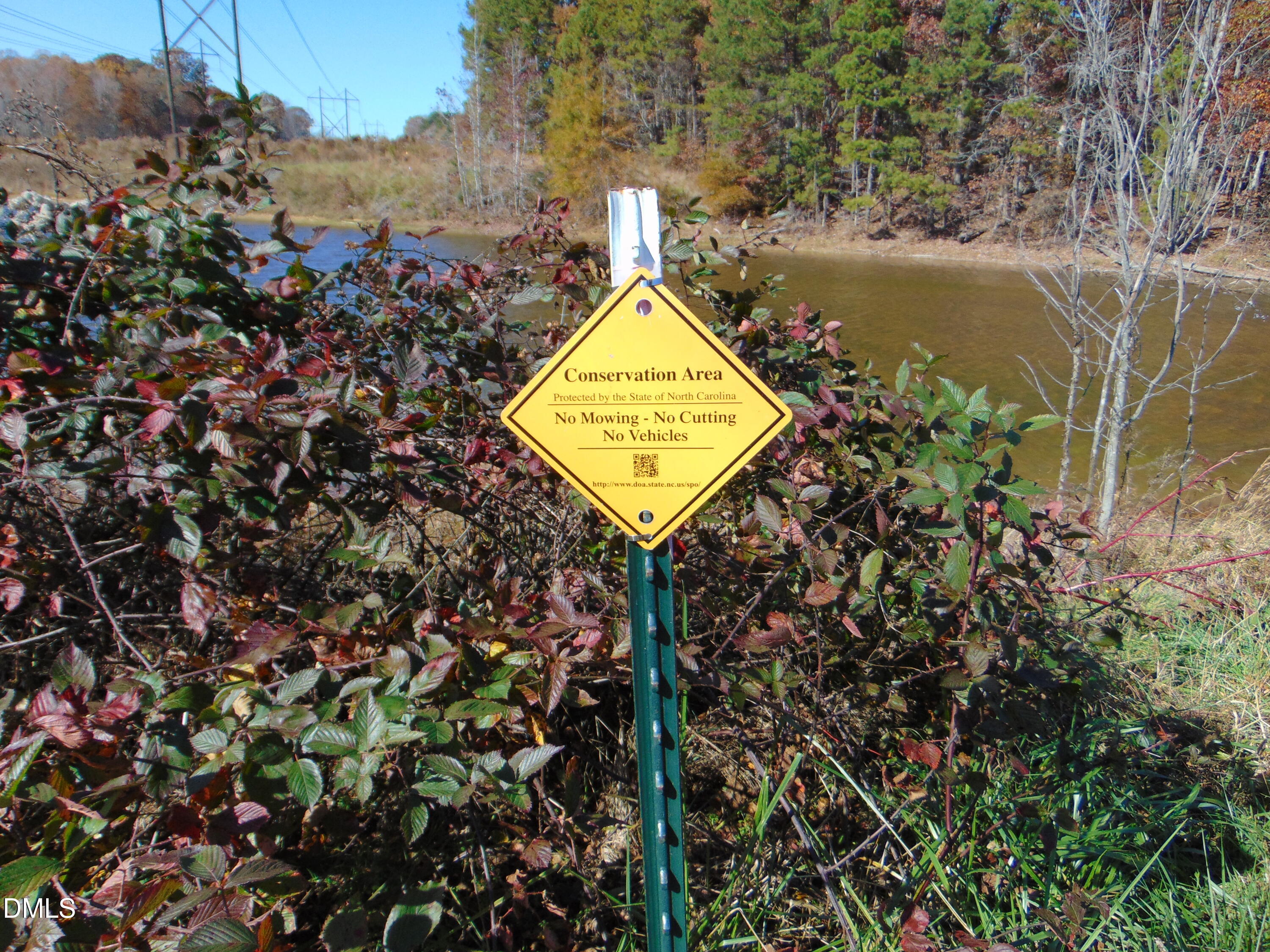 0 Antioch Church Road Roxboro, NC 27574 - Photo 24 of 61 a sign board with a lake view