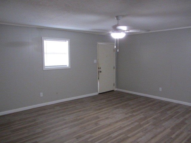 505 13th Street Huntsville, TX 77340 - Photo 6 of 12 wooden floor in an empty room with a window