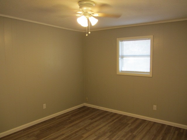 505 13th Street Huntsville, TX 77340 - Photo 8 of 12 a view of a room with wooden floor and windows