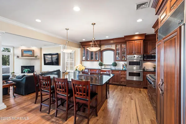 a large kitchen with a table and chairs