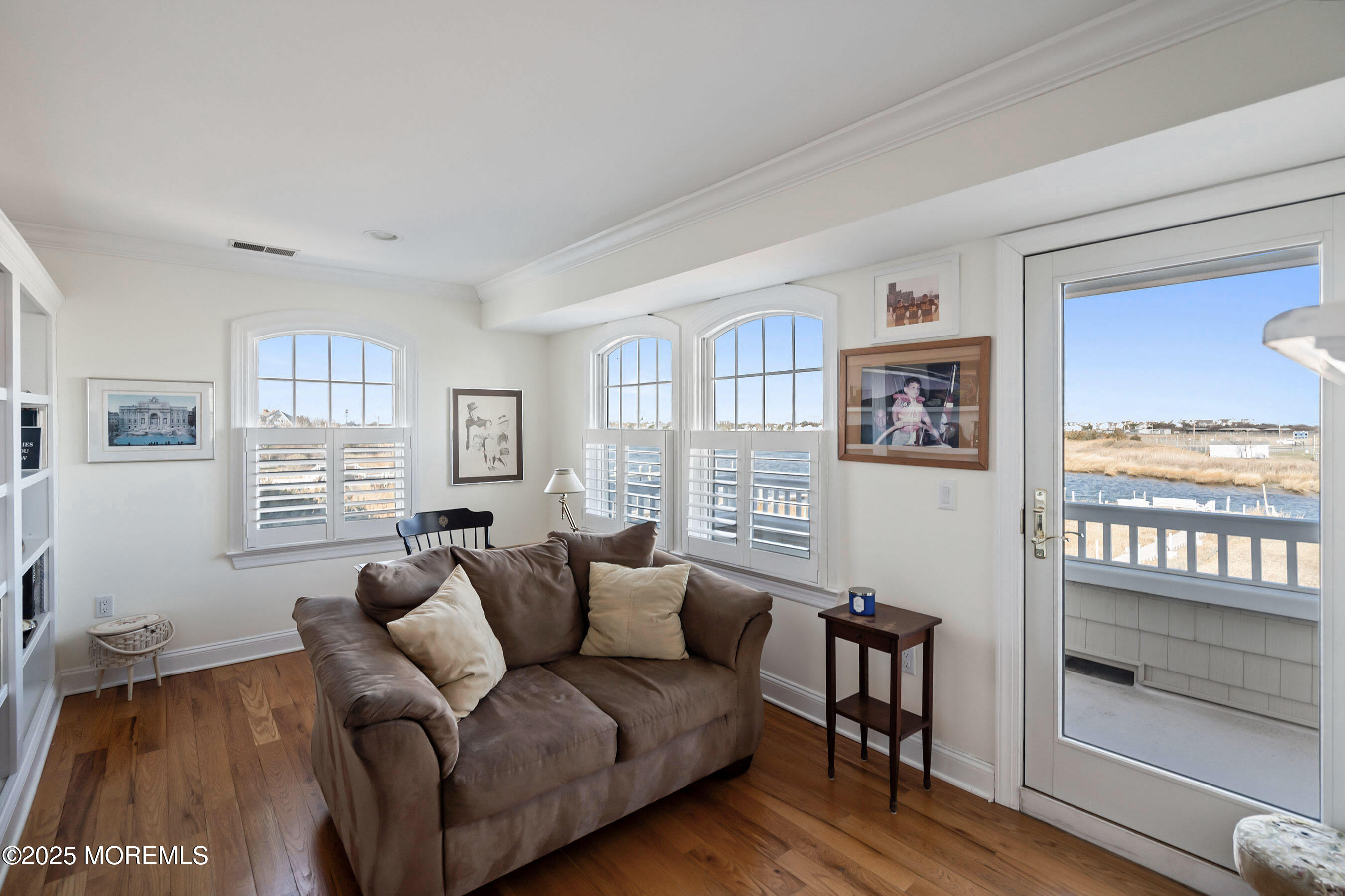 38 Ocean Avenue Manasquan, NJ 08736 - Photo 14 of 42 a living room with furniture a large window and wooden floor