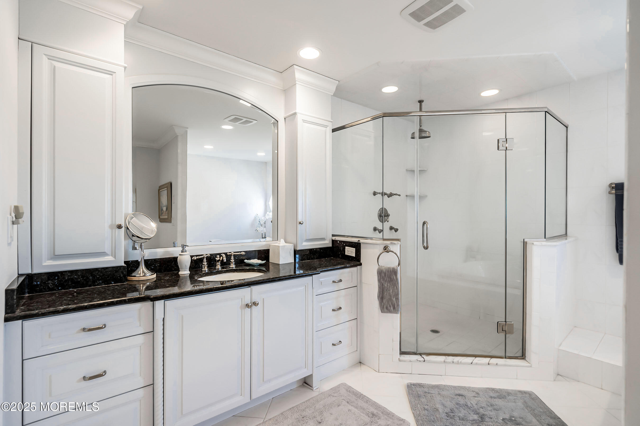 38 Ocean Avenue Manasquan, NJ 08736 - Photo 17 of 42 a bathroom with double sink and a mirror