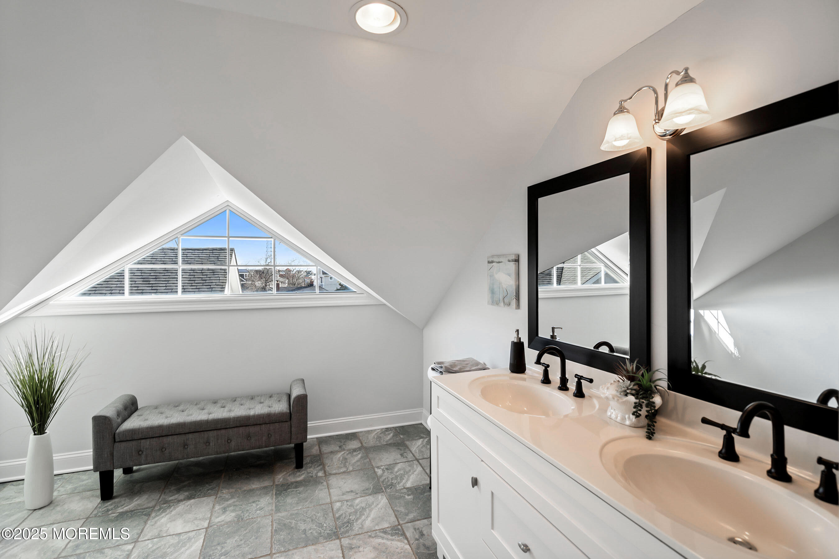38 Ocean Avenue Manasquan, NJ 08736 - Photo 25 of 42 a bathroom with a sink and a mirror