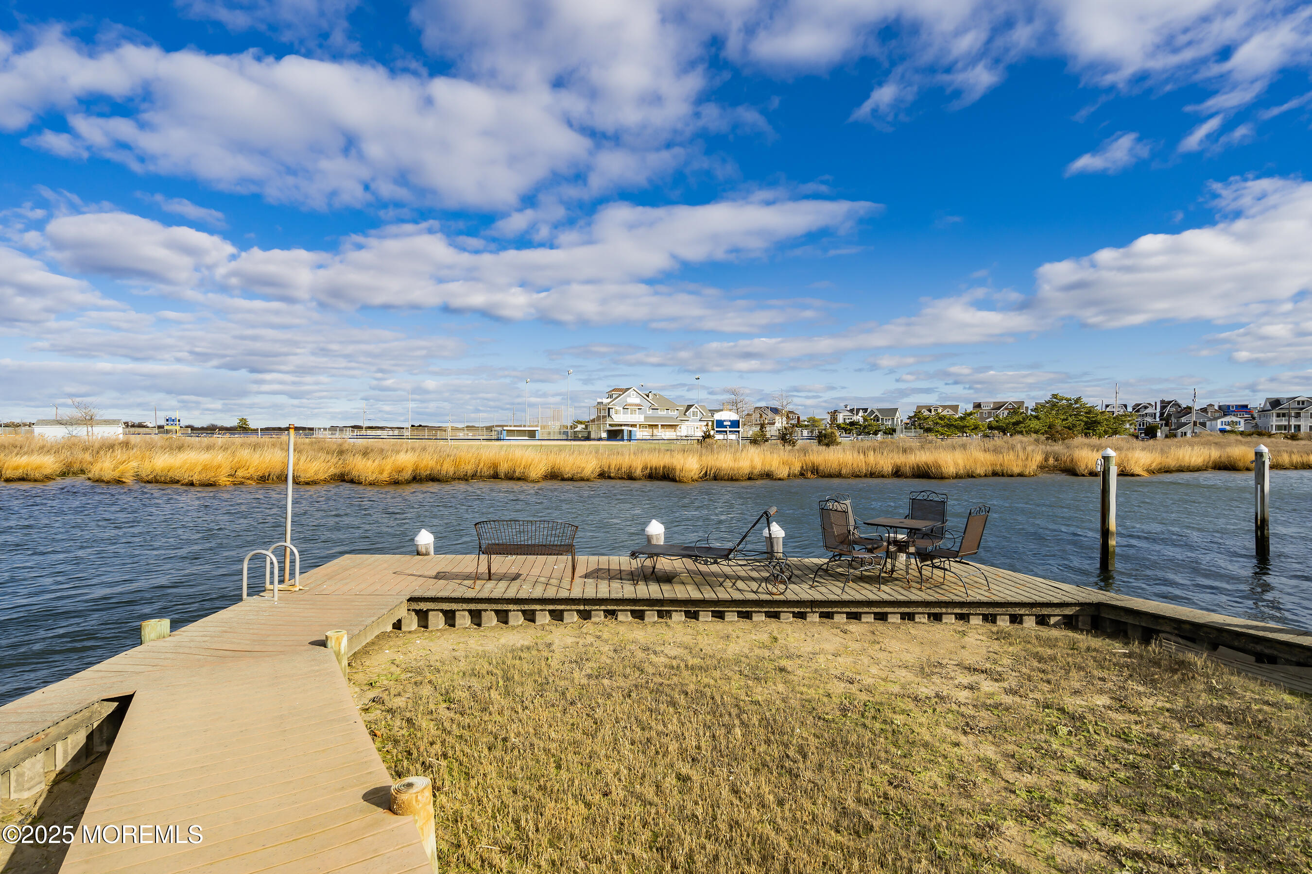 38 Ocean Avenue Manasquan, NJ 08736 - Photo 29 of 42 a view of a water with boats and trees in the back