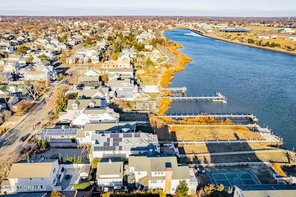 an aerial view of residential houses and outdoor space
