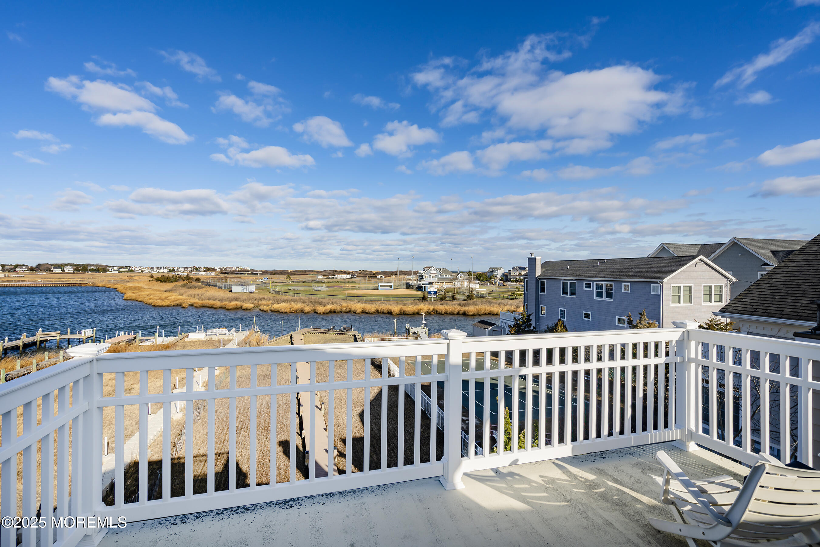 38 Ocean Avenue Manasquan, NJ 08736 - Photo 5 of 42 a view of a balcony with wooden floor and city view