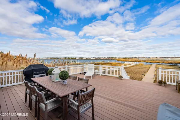 a view of a terrace with furniture and wooden floor