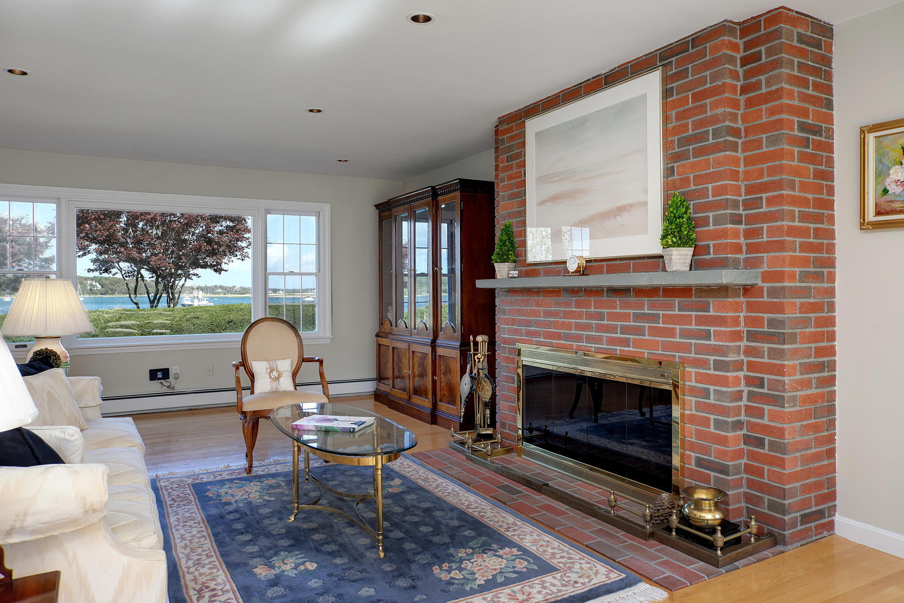 289 East Bay Road Osterville, MA 02655 - Photo 11 of 30 a living room with furniture a rug and a fireplace