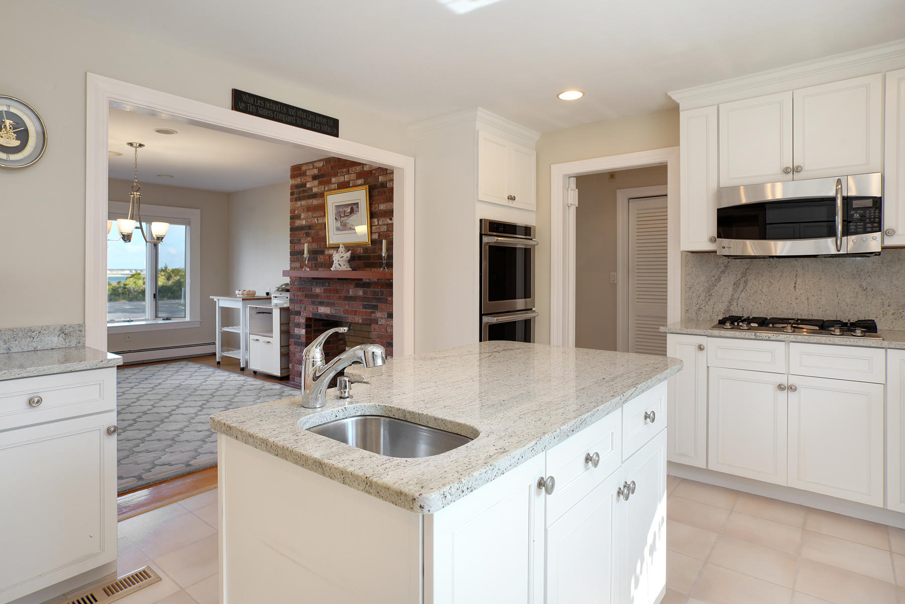 289 East Bay Road Osterville, MA 02655 - Photo 15 of 30 a kitchen with granite countertop a sink and a stove top oven