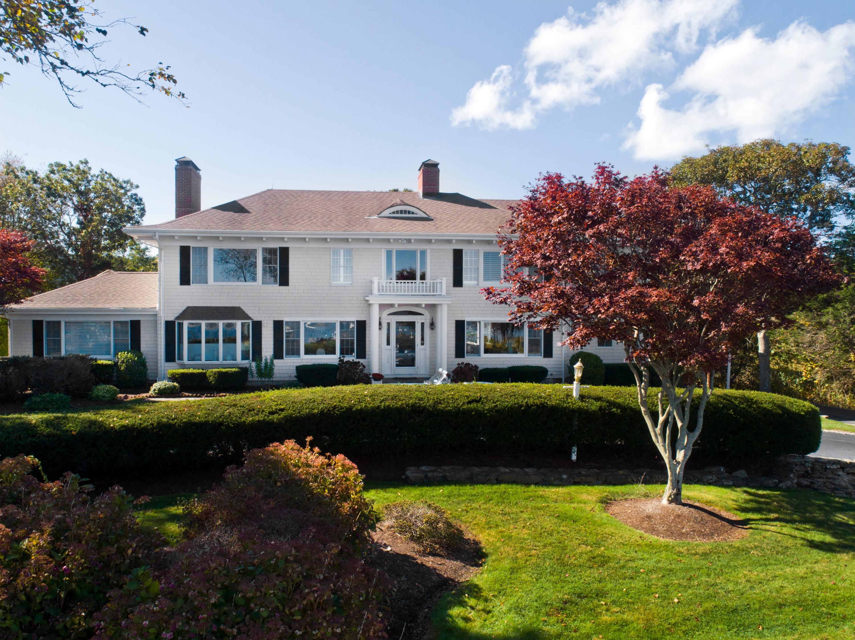 289 East Bay Road Osterville, MA 02655 - Photo 2 of 30 a front view of a house with garden