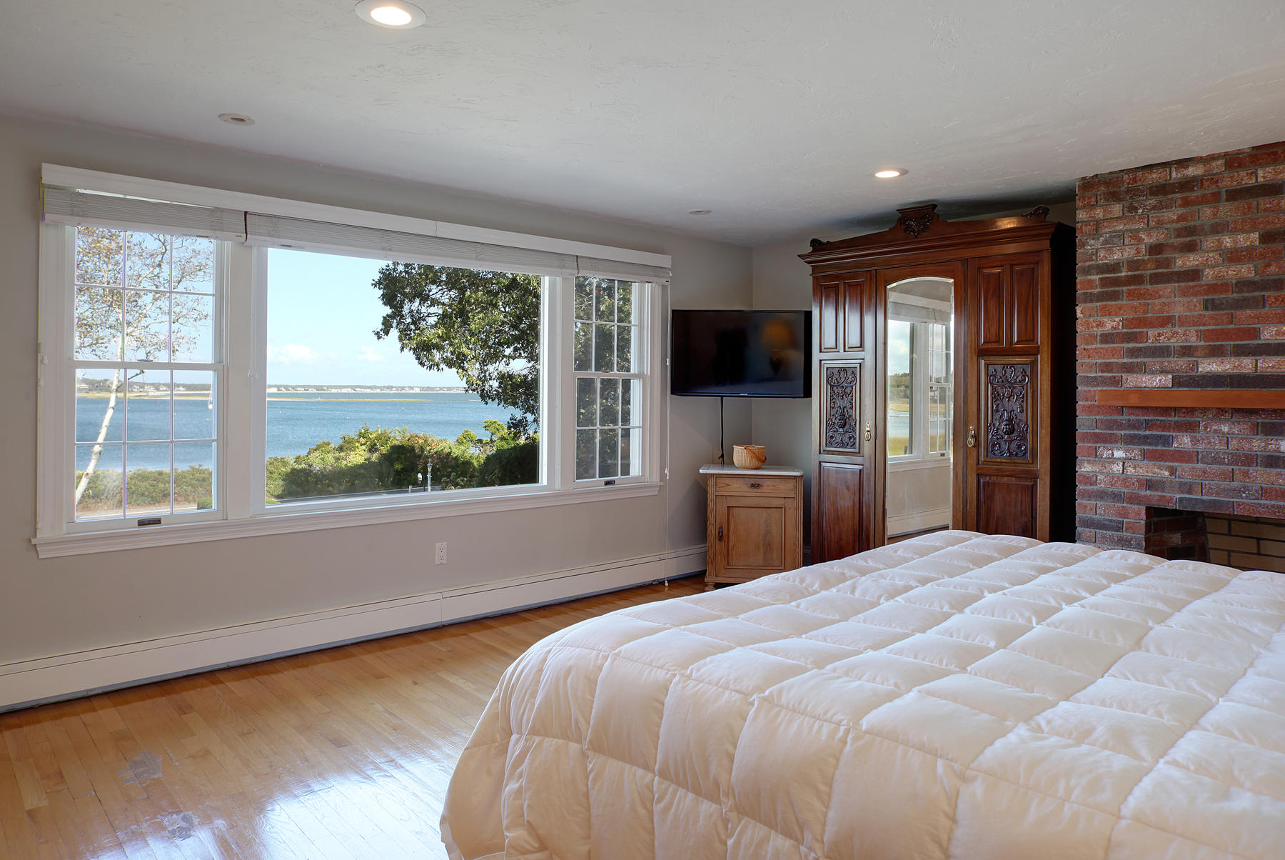 289 East Bay Road Osterville, MA 02655 - Photo 21 of 30 a bedroom with a bed and a large window