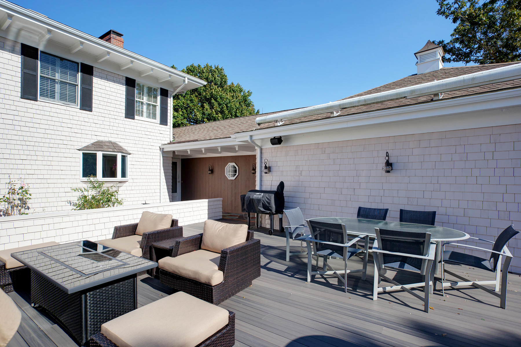 289 East Bay Road Osterville, MA 02655 - Photo 24 of 30 a view of a patio with couches and a table and chairs with wooden floor
