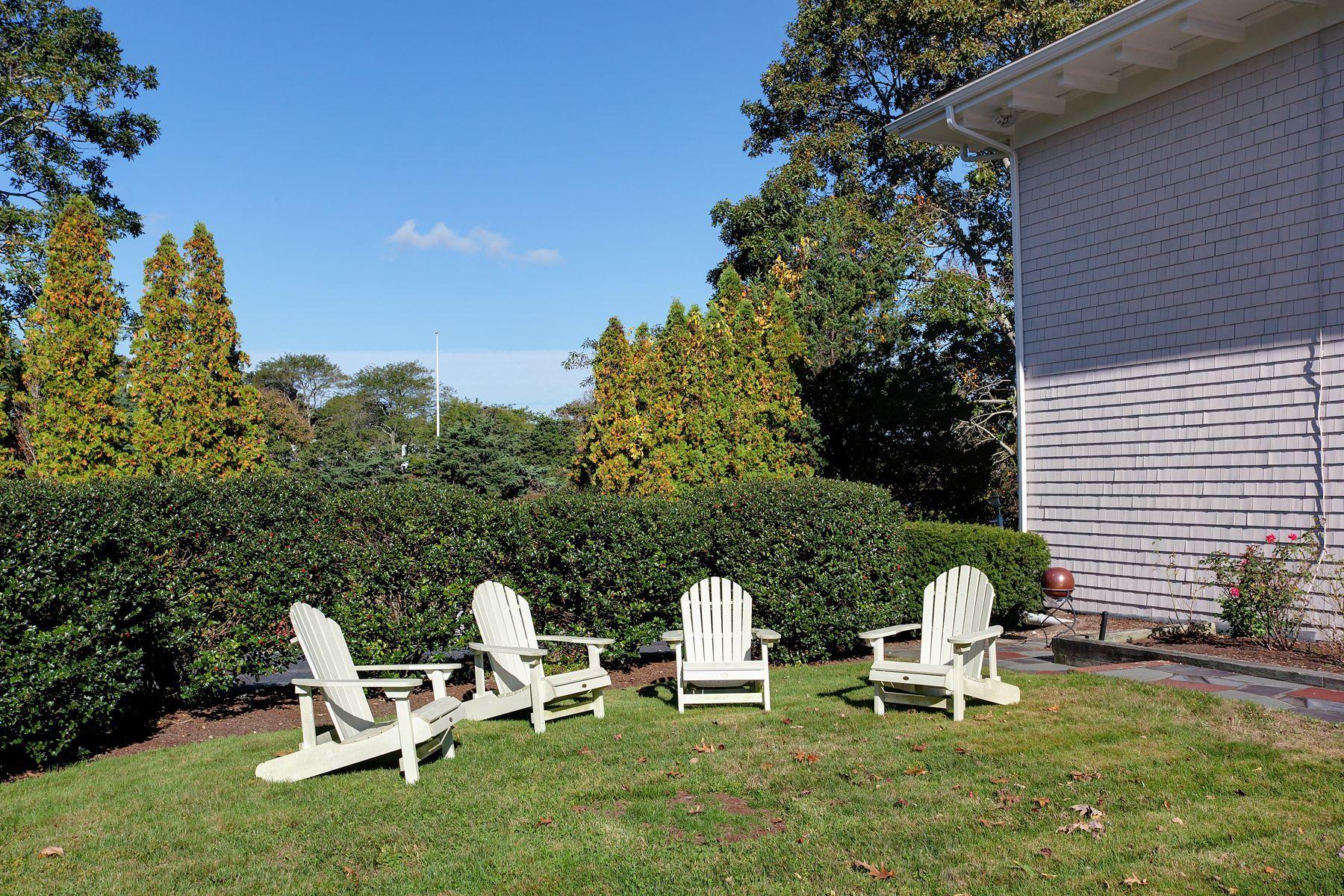 289 East Bay Road Osterville, MA 02655 - Photo 25 of 30 a view of a two chairs in a backyard