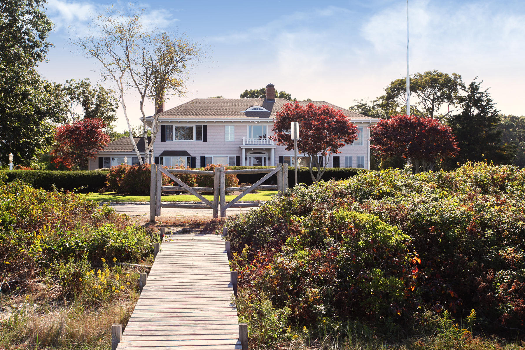 289 East Bay Road Osterville, MA 02655 - Photo 27 of 30 a front view of a house with a yard and fountain