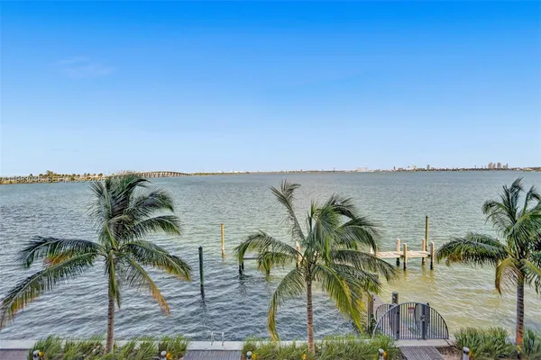 a view of a swimming pool with an outdoor seating