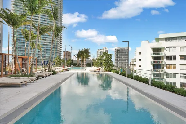 a view of swimming pool from a balcony