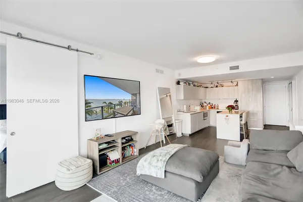 a living room with furniture and a flat screen tv