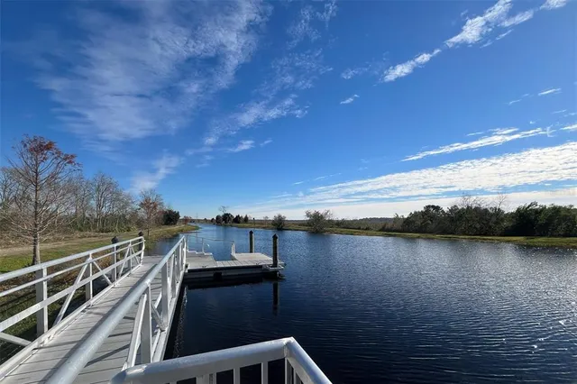 a view of a backyard with swimming pool