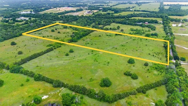 a view of a swimming pool with a yard