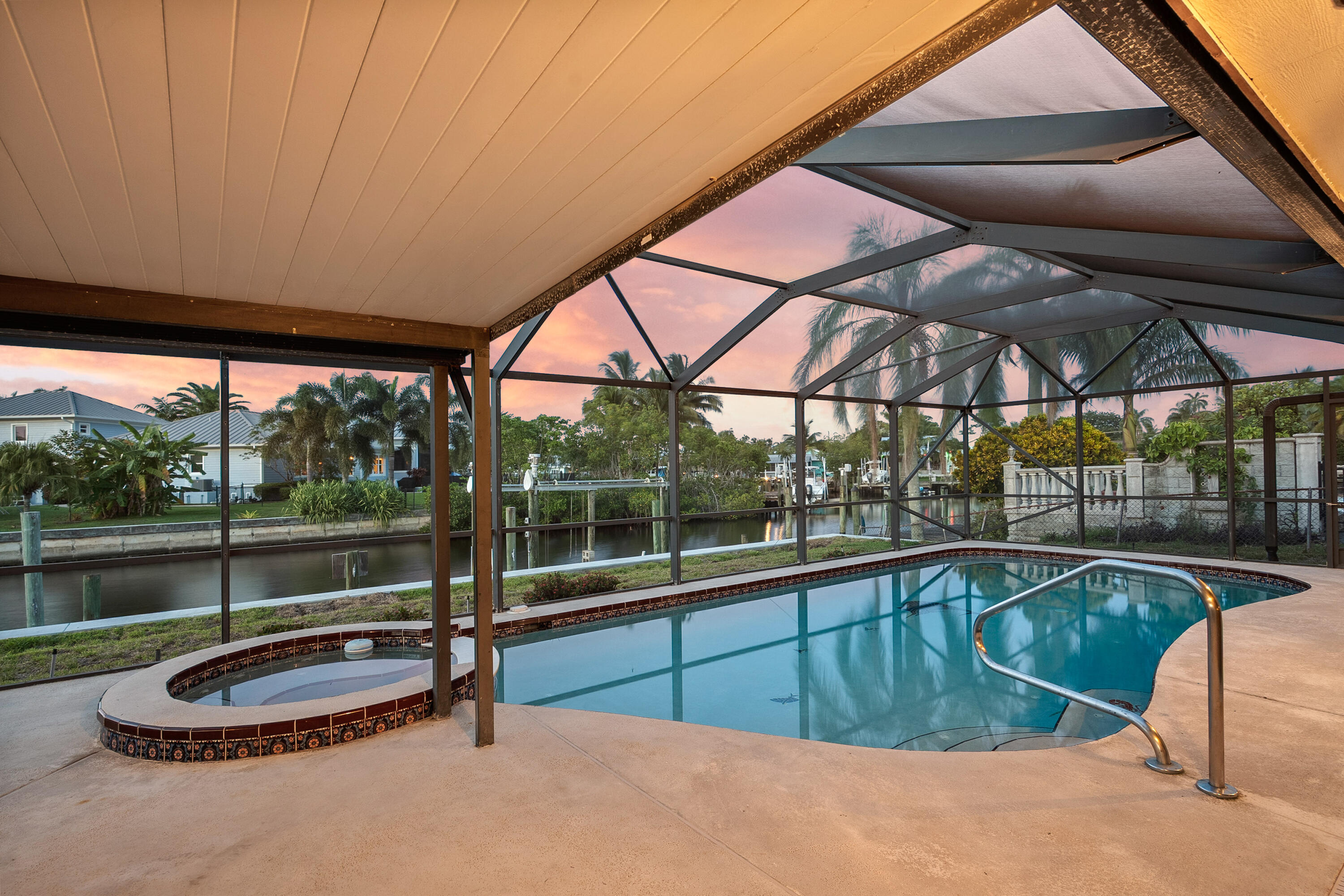 1545 Southwest Dyer Point Road Palm City, FL 34990 - Photo 40 of 44 Beautiful evenings around the pool.