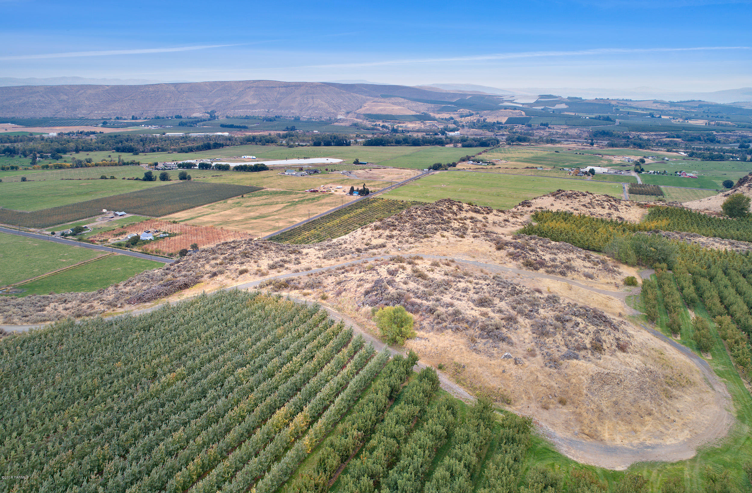 0 Rudd Road, Unit LOT 2 Tieton, WA 98947 - Photo 10 of 10 a view of a lake with a mountain