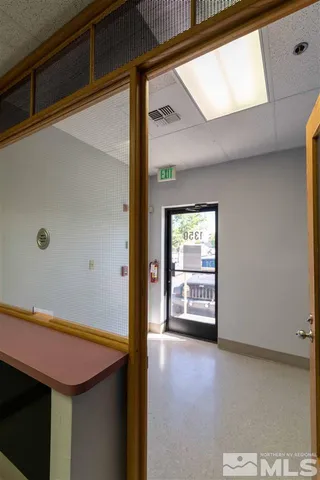 a view of a hallway with a chandelier