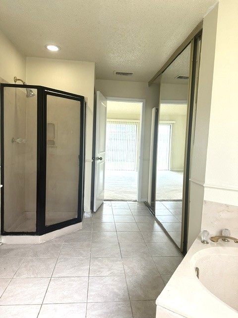 14702 Rancho Vista Drive Houston, TX 77083 - Photo 9 of 18 a view of a bathroom with tub and shower