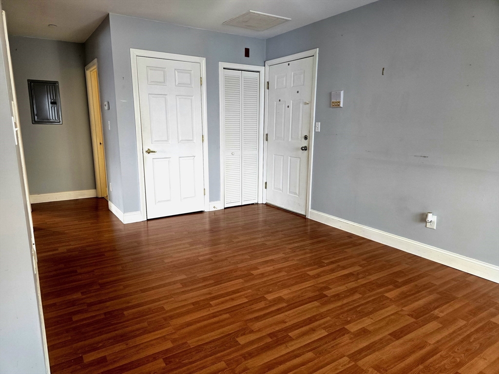 303 Eagle Street, Unit C Fall River, MA 02721 - Photo 11 of 32 a view of a room with wooden floor