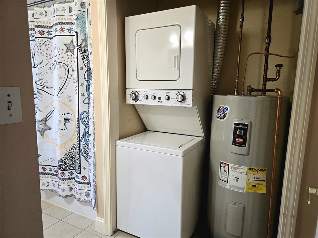 303 Eagle Street, Unit C Fall River, MA 02721 - Photo 23 of 32 a utility room with dryer and washer
