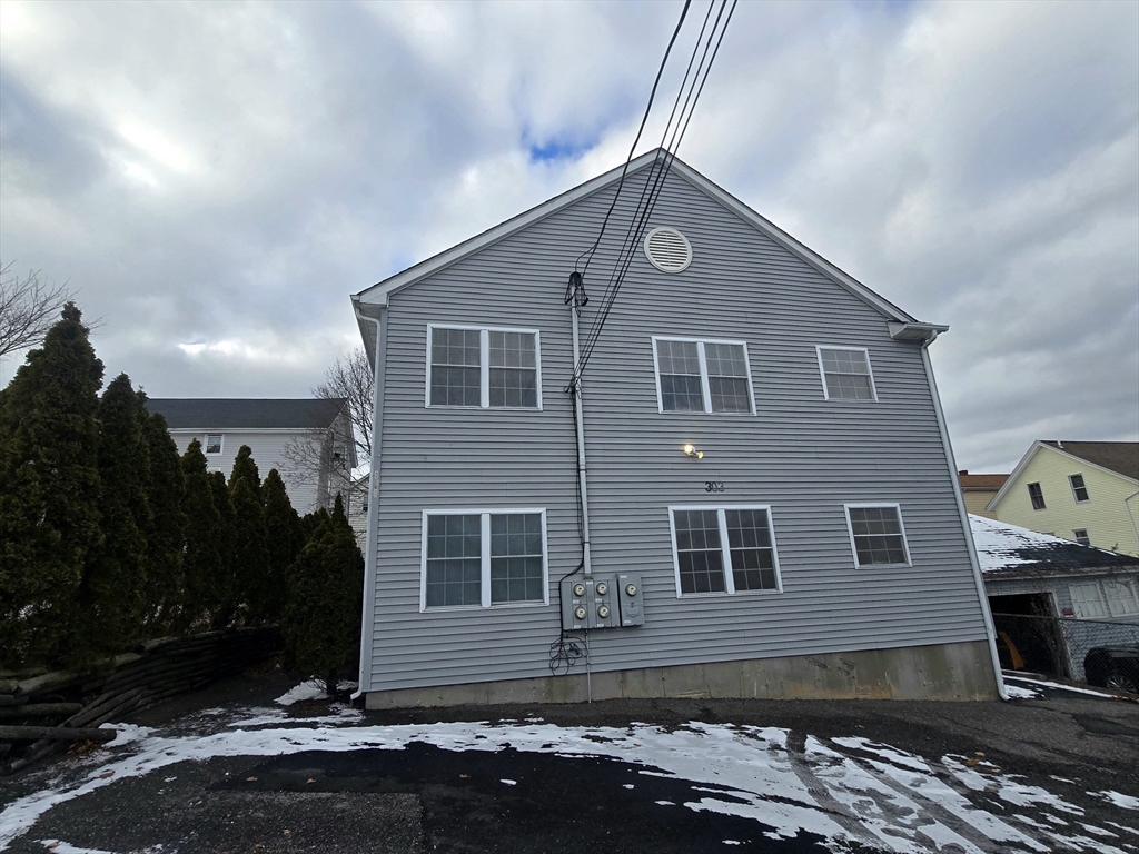 303 Eagle Street, Unit C Fall River, MA 02721 - Photo 27 of 32 a front view of a house with a yard