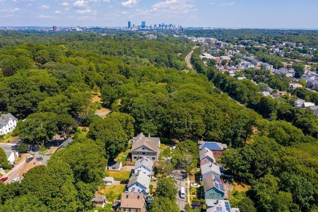 52 Arborough Road Boston, MA 02131 - Photo 3 of 35 an aerial view of a residential houses with city view