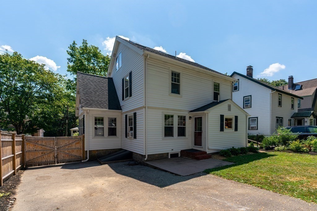 52 Arborough Road Boston, MA 02131 - Photo 31 of 35 a front view of a house with garden