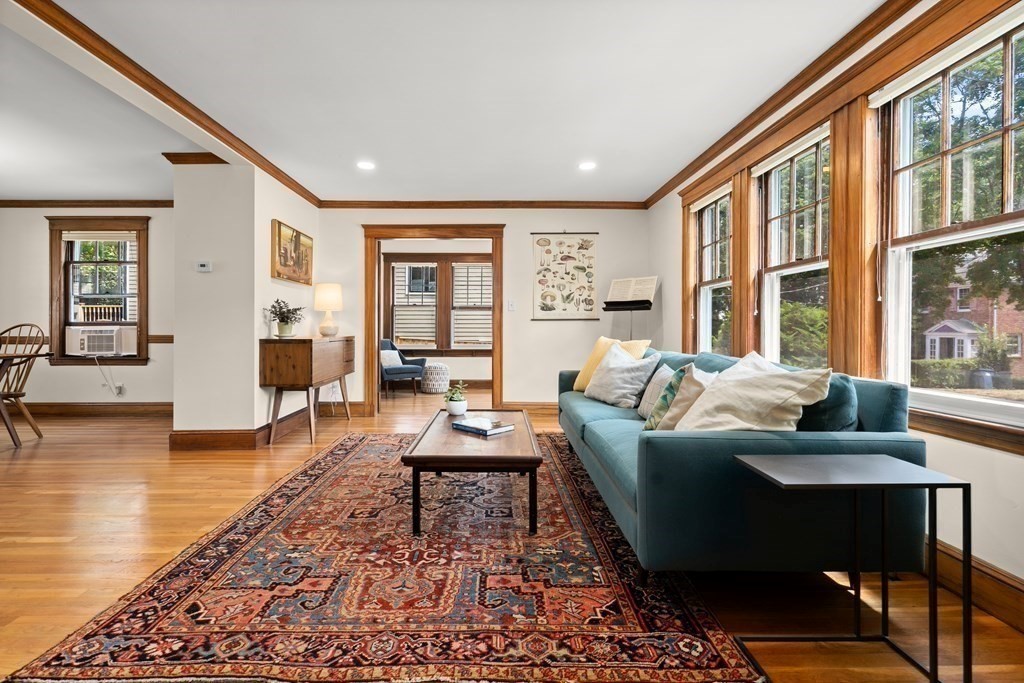 52 Arborough Road Boston, MA 02131 - Photo 4 of 35 a living room with furniture and a table
