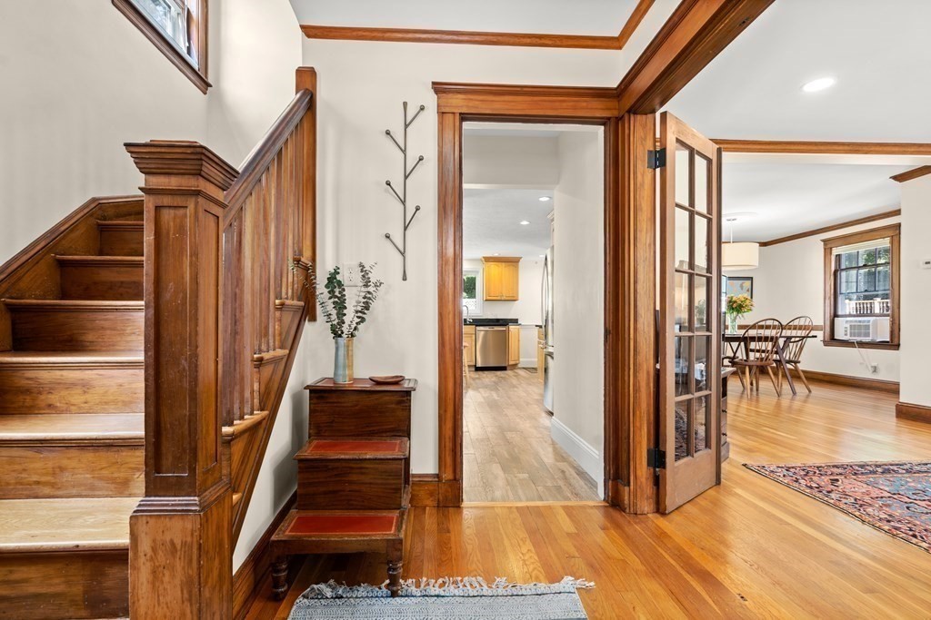 52 Arborough Road Boston, MA 02131 - Photo 8 of 35 a view of a hallway with furniture and floor to ceiling window