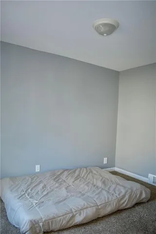 a bedroom with a bed