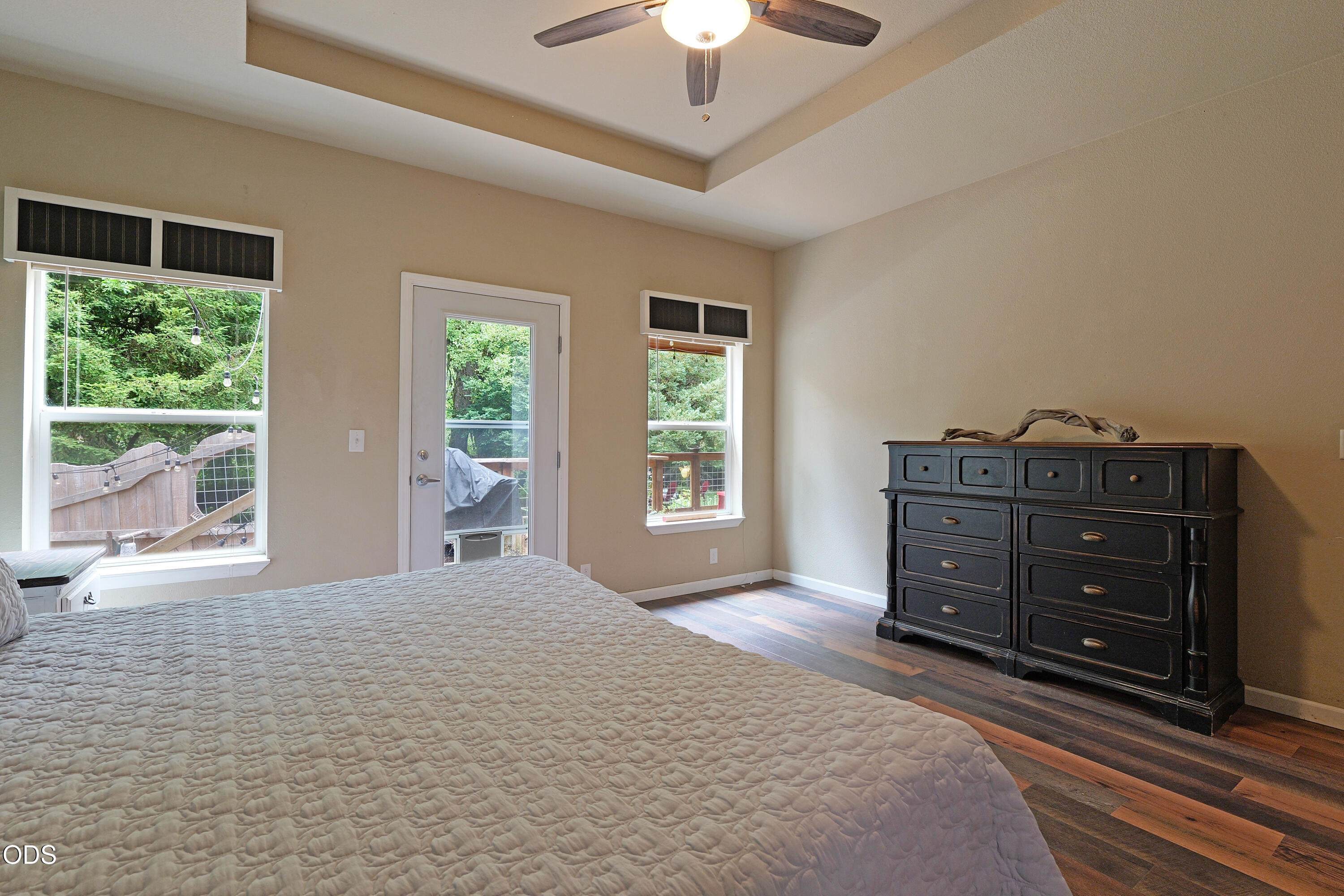 52 Dodes Creek Road Trail, OR 97541 - Photo 46 of 111 a bedroom with a bed and a chandelier