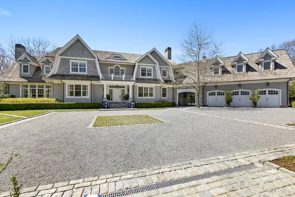 a view of multiple houses with a street