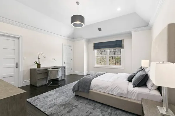 a bedroom with a bed and a table in it