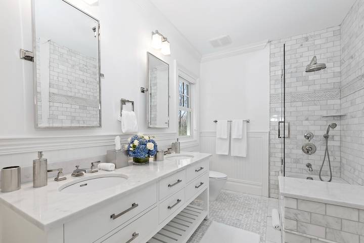 496 Wainscott Harbor Road Sagaponack, NY 11962 - Photo 14 of 20 a bathroom with a double vanity sink mirror double shower and bathtub
